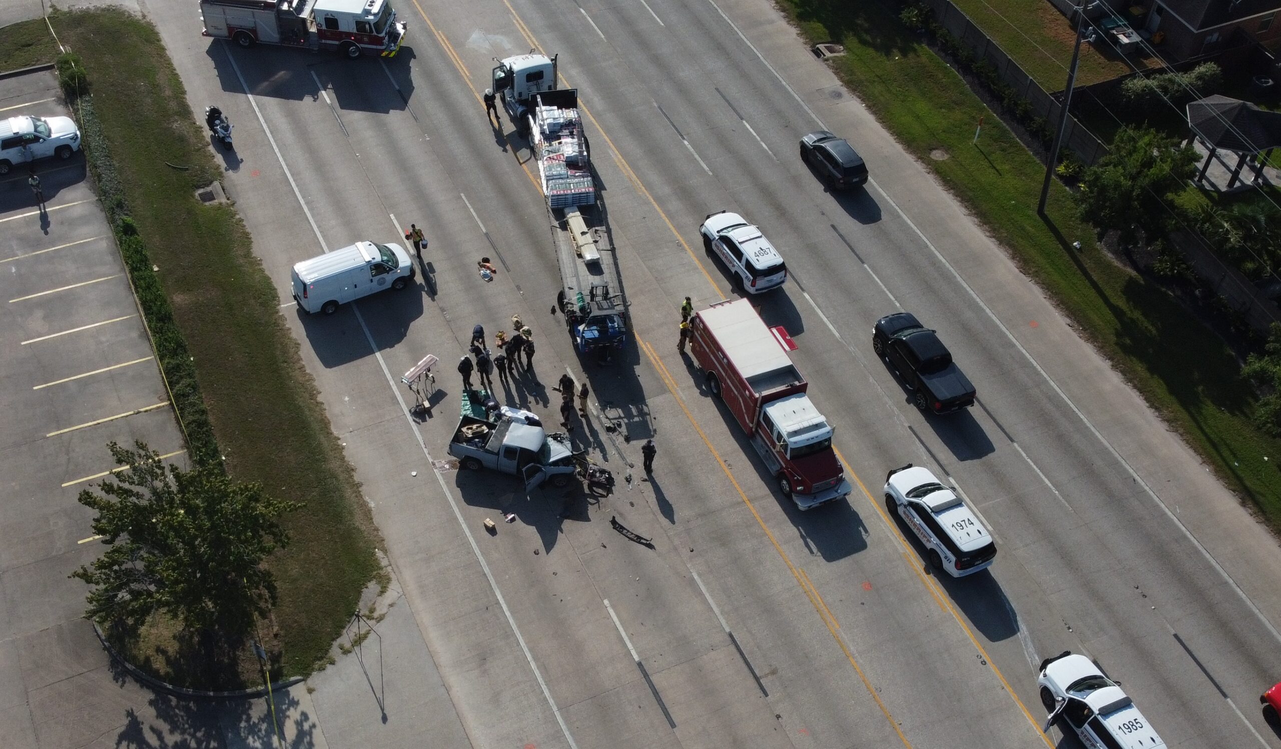 Fatal truck crash scene on West Mount Houston Road in Houston involving an 18-wheeler and pickup truck